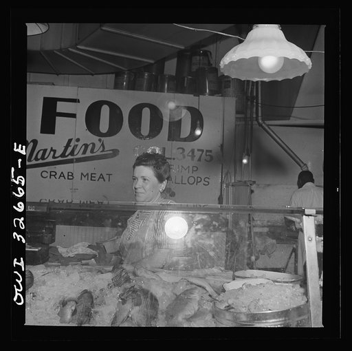 Untitled photo, possibly related to: Washington, D.C. Blanche Beavers waiting on a customer in the Arcade seafood market