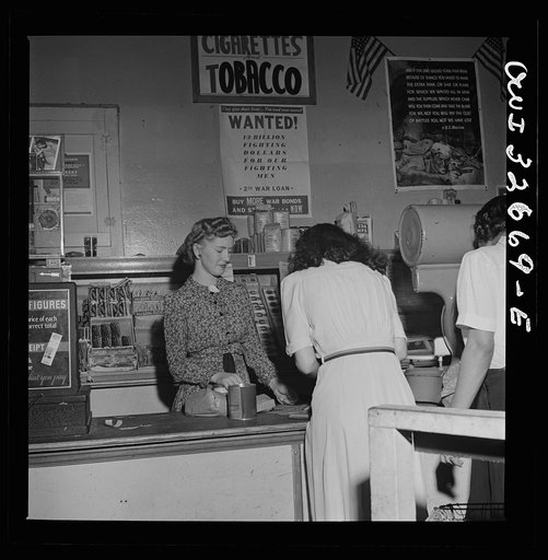 Washington, D.C. Two boys waiting to help customers with their orders at the grocery store