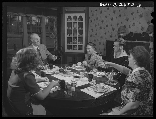 Untitled photo, possibly related to: Oswego, New York. Norwegian sailor and naval officer having breakfast in the home of a college professor where they stayed during United Nations week