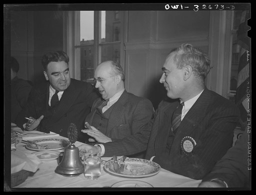 Oswego, New York. Czechoslovakian consul (center), a guest at the Rotary Club luncheon, talking with the president of the Chamber of Commerce