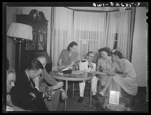 Untitled photo, possibly related to: A French naval officer being entertained in a Polish-American home during United Nations week