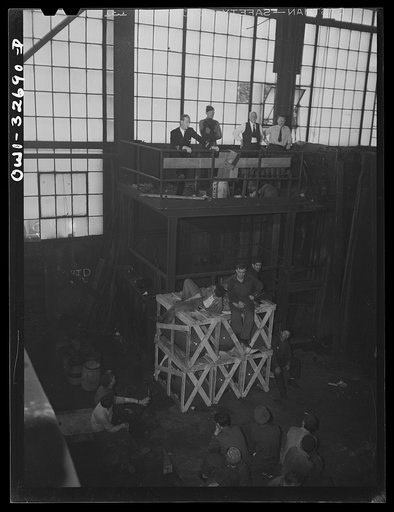 Untitled photo, possibly related to: Oswego, New York. Workers in the Fitzgibbons tank factory listening to the speeches by the United Nations heroes during United Nations week