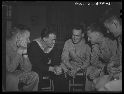 Oswego, New York. A Norwegian sailor talking informally with air cadets who are entertaining United Nations heroes at a supper during United nations week.