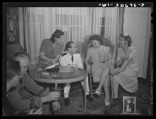 A French naval officer being entertained in a Polish-American home during United Nations week