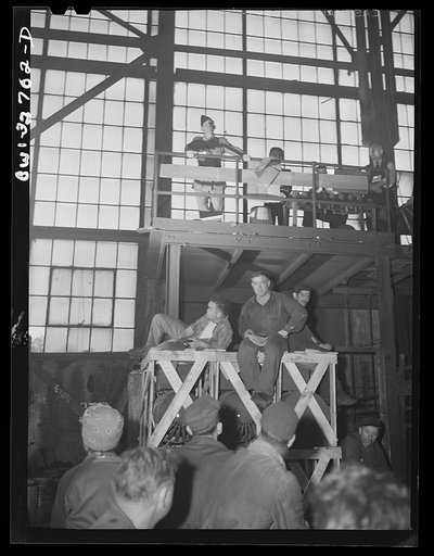 Untitled photo, possibly related to: Oswego, New York. Workers in the Fitzgibbons tank factory listening to the speeches by the United Nations heroes during United Nations week