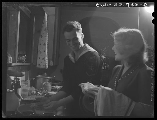 Untitled photo, possibly related to: Oswego, New York. Norwegian sailor helping his hostess's daughter to clear the breakfast table during United Nations week