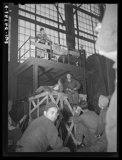 Untitled photo, possibly related to: Oswego, New York. Workers in the Fitzgibbons tank factory listening to the speeches by the United Nations heroes during United Nations week