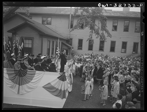 Untitled photo, possibly related to: Oswego, New York. During United Nations week, a Polish naval officer addressing workers at the Columbia Mills in Polish; many of them are Polish-American