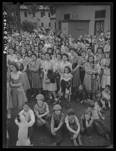 Untitled photo, possibly related to: Oswego, New York. During United Nations week, a Polish naval officer addressing workers at the Columbia Mills in Polish; many of them are Polish-American