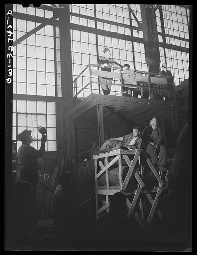 Untitled photo, possibly related to: Oswego, New York. Workers in the Fitzgibbons tank factory listening to the speeches by the United Nations heroes during United Nations week