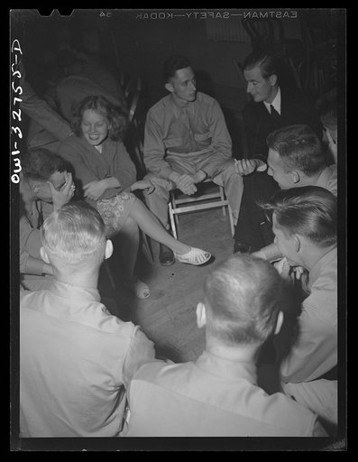 Untitled photo, possibly related to: Oswego, New York. A Norwegian sailor talking informally with air cadets who are entertaining United Nations heroes at a supper during United nations week
