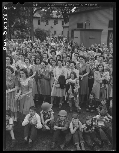 Untitled photo, possibly related to: Oswego, New York. During United Nations week, a Polish naval officer addressing workers at the Columbia Mills in Polish; many of them are Polish-American