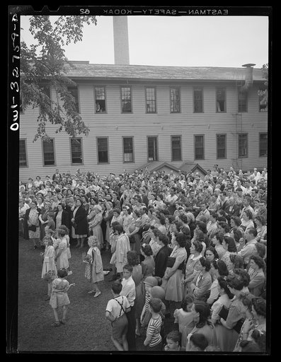 Untitled photo, possibly related to: Oswego, New York. During United Nations week, a Polish naval officer addressing workers at the Columbia Mills in Polish; many of them are Polish-American