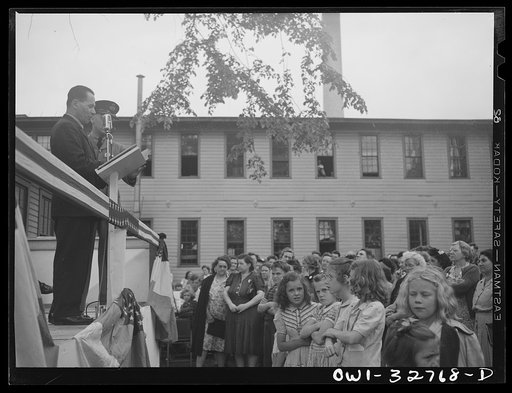 Untitled photo, possibly related to: Oswego, New York. During United Nations week, a Polish naval officer addressing workers at the Columbia Mills in Polish; many of them are Polish-American