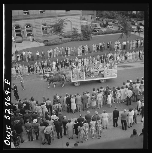 Untitled photo, possibly related to: Oswego, New York. Ames Ironworks float, drawn by horses because of the gas rationing, in the United Nations week parade
