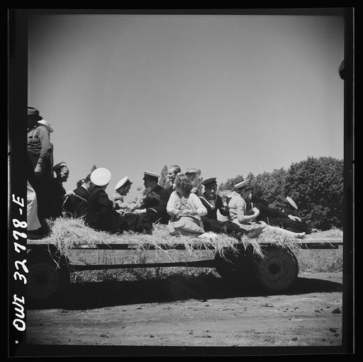 Untitled photo, possibly related to: Oswego, New York. Belgian sailor leads singing on a hayride for the United Nations heroes and Oswego girls during United Nations week