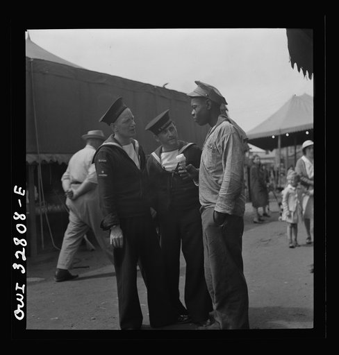 Untitled photo, possibly related to: Oswego, New York. Belgian and Greek sailors talking with a Negro worker at the carnival during United Nations week