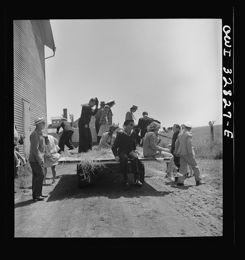 Untitled photo, possibly related to: Oswego, New York. Belgian sailor leads singing on a hayride for the United Nations heroes and Oswego girls during United Nations week