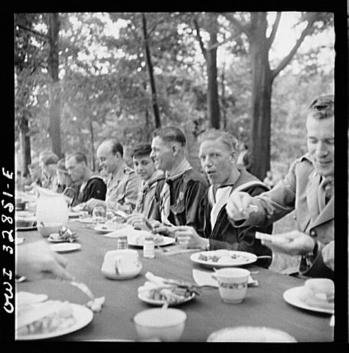 Untitled photo, possibly related to: Oswego, New York. Norwegian and Belgian sailors having lunch at the boy scout outing during United Nations week