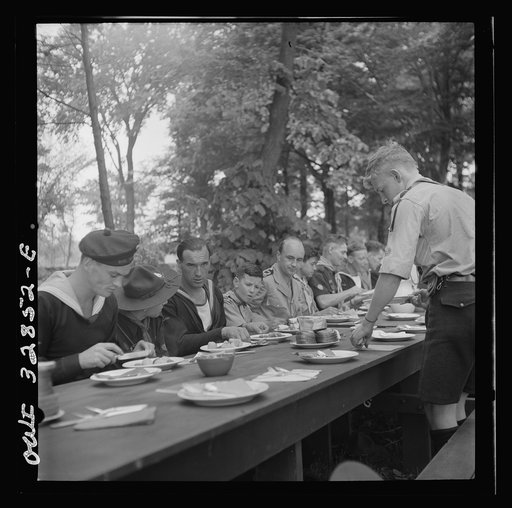 Untitled photo, possibly related to: Oswego, New York. Norwegian and Belgian sailors having lunch at the boy scout outing during United Nations week