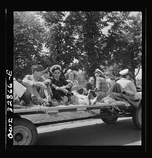 Untitled photo, possibly related to: Oswego, New York. A hayride for the United Nations heroes and Oswego girls, during United Nations week