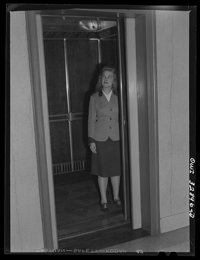 Philadelphia, Pennsylvania. Miss Dorothy Eyster, an elevator operator at a downtown office building