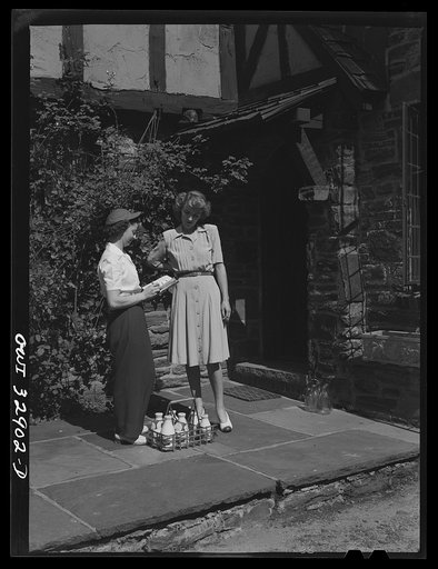 Bryn Mawr, Pennsylvania. Mrs. Helen Joyce, one of the many women now working for the Supplee-Wills-Jones Milk Company. She is making her rounds collecting bills