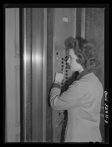 Philadelphia, Pennsylvania. Miss Jane Sherwood, an elevator operator at a downtown office building