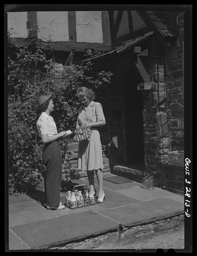 Untitled photo, possibly related to: Bryn Mawr, Pennsylvania. Mrs. Helen Joyce, one of the many women now working for the Supplee-Wills-Jones Milk Company. She is making her rounds collecting bills
