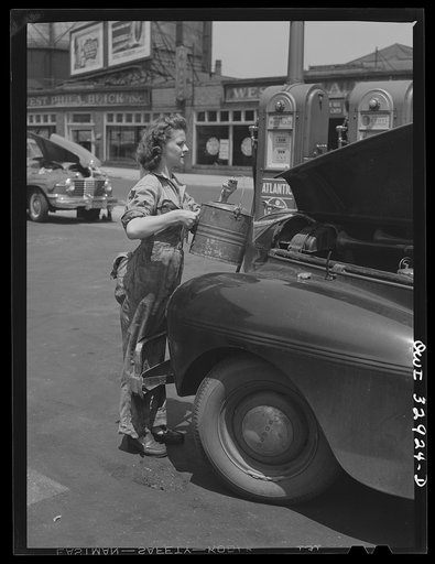 Untitled photo, possibly related to: Philadelphia, Pennsylvania. Miss Ruth Gusick, formerly a clerk in a drugstore, now works as a garage attendant at one of the Atlantic Refining Company garages