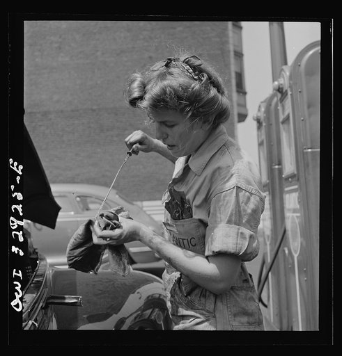 Untitled photo, possibly related to: Philadelphia, Pennsylvania. Miss Natalie O'Donald, a garage attendant at the Atlantic Refining Company garages