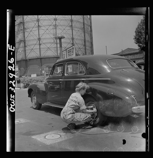 Untitled photo, possibly related to: Philadelphia, Pennsylvania. Miss Natalie O'Donald, a garage attendent at the Atlantic Refining Company