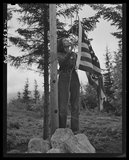 Untitled photo, possibly related to: Gorham (vicinity), New Hampshire. Barbara Mortensen, a fire and airplane lookout on Pine Mountain, running up the colors