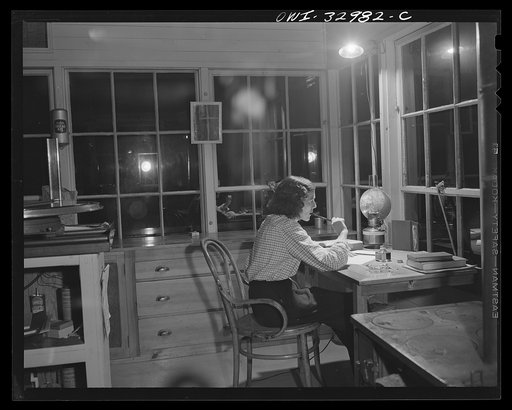 Gorham (vicinity), New Hampshire. Evenings are long and lonely for Barbara Mortensen, a fire and airplane lookout on Pine Mountain. Barbara reads or writes letters to her husband who is in the Navy