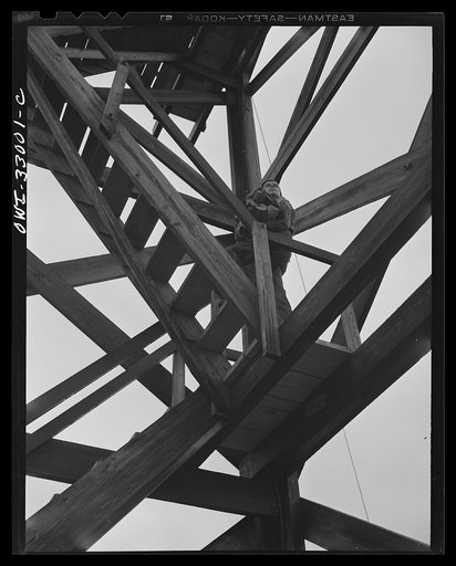 Gorham (vicinity), New Hampshire. Barbara Mortensen, a fire and airplane lookout on Pine Mountain, does all her cooking in the tower. Wood and water must be carried up fifty-six steps from the mountain top below