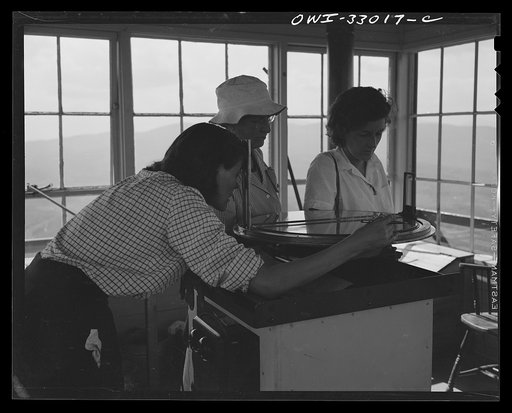 Gorham (vicinity), New Hampshire. Many visitors climb up from Gorham to visit the fire lookout tower on Pine Mountain. Barbara Mortensen, as fire guard for the national forests, uses these occasions to educate the public in fire prevention and conservation