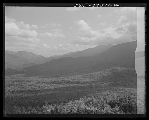 Gorham (vicinity), New Hampshire. A view east through the White Mountains from the fire tower manned by Barbara Mortensen, a fire and airplane lookout on Pine Mountain