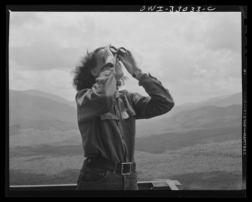 Gorham (vicinity), New Hampshire. Barbara Mortensen, a fire and airplane lookout on Pine Mountain, identifying a plane for the Interceptor Command