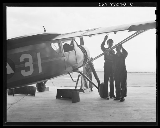 Untitled photo, possibly related to: Bar Harbor, Maine. Civil Air Patrol base headquarters of coastal patrol no. 20. Major James B. King, base commander, making weekly inspection