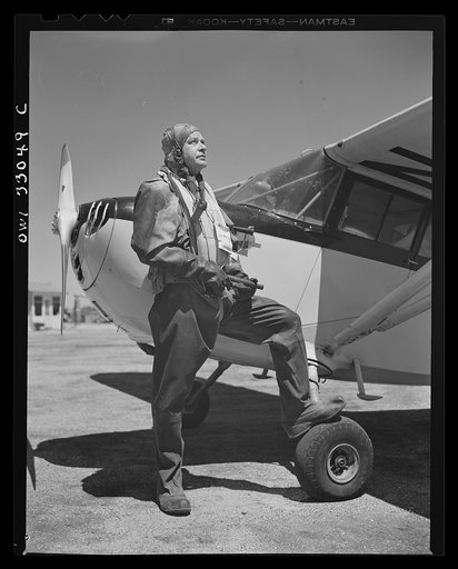 Bar Harbor, Maine. Civil Air Patrol base headquartes of coastal patrol no. 20. A flyer wearing an all-rubber, watertight crash suit to save his life if he crashes in sub-zero weather