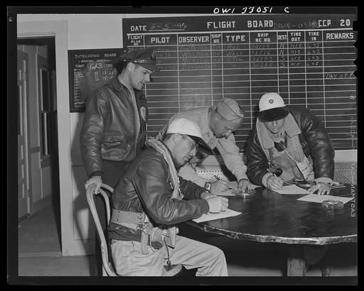 Untitled photo, possibly related to: Bar Harbor, Maine. Civil Air Patrol base headquarters of coastal patrol no. 20. Dawn patrol flyers and observers making routine reports before starting on patrol
