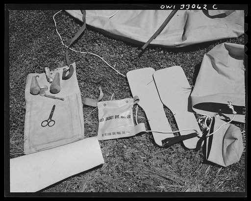 Bar Harbor, Maine. Civil Air Patrol base headquarters of coastal patrol no. 20. Safety equipment issued to each plane: paddles for the rubber boat, sea bucket for bailing and keeping the boat into seas, dye container to stain the surrounding water and facilitate identification from the air, and mend