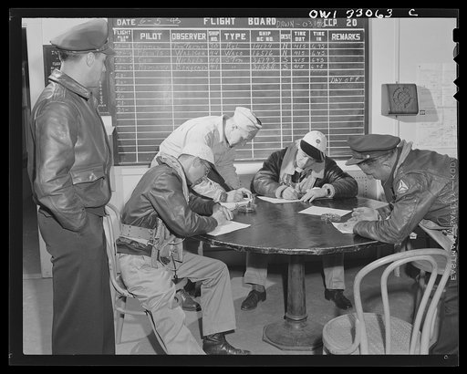 Untitled photo, possibly related to: Bar Harbor, Maine. Civil Air Patrol base headquarters of coastal patrol no. 20. Dawn patrol flyers and observers making routine reports before starting on patrol