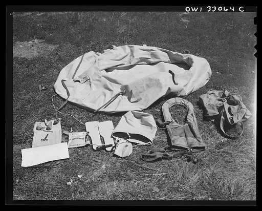Bar Harbor, Maine. Civil Air Patrol base headquarters of coastal patrol no. 20. Full safety equipment for one pilot; rubber boat, paddles, seabucket, mending kit for bullet holes "Mae West" life preserver, and dye sack to stain the surrounding water and facilitate detection from the air