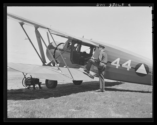 Bar Harbor, Maine. Civil Air Patrol base headquartes of coastal patrol no. 20. Ground crew mechanics overhauling a tail assembly during routine check-over