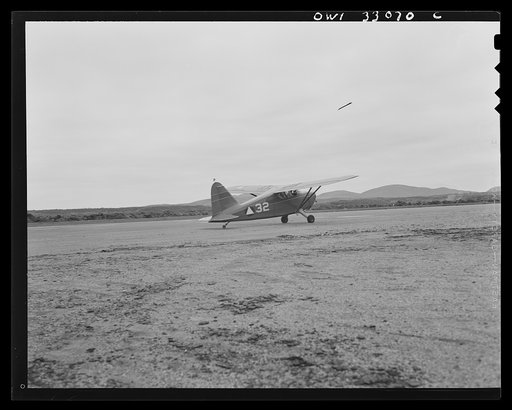 Untitled photo, possibly related to: Bar Harbor, Maine. Civil Air Patrol base headquarters of coastal patrol no. 20. Taking off for the dawn patrol