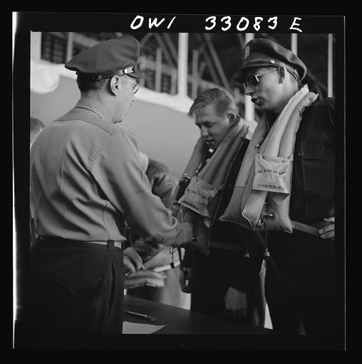 Untitled photo, possibly related to: Bar Harbor, Maine. Civil Air Patrol base headquarters of coastal patrol no. 20. Routine check of "Mae West" life preservers