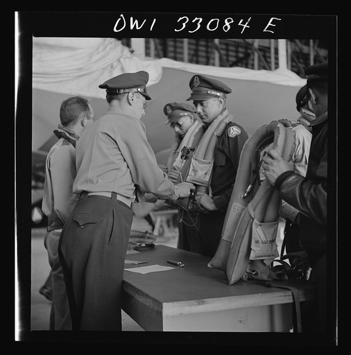 Untitled photo, possibly related to: Bar Harbor, Maine. Civil Air Patrol base headquarters of coastal patrol no. 20. Routine check of "Mae West" life preservers