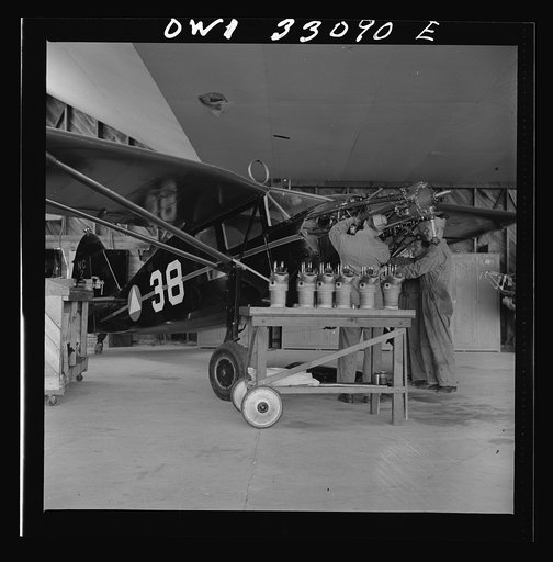 Bar Harbor, Maine. Civil Air Patrol base headquarters of coastal patrol no. 20. Replacing the cylinders in a plane after overhauling it