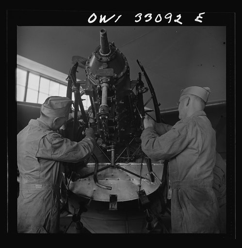 Bar Harbor, Maine. Civil Air Patrol base headquarters of coastal patrol no. 20. Plane engine receiving a routine overhaul in the hangar